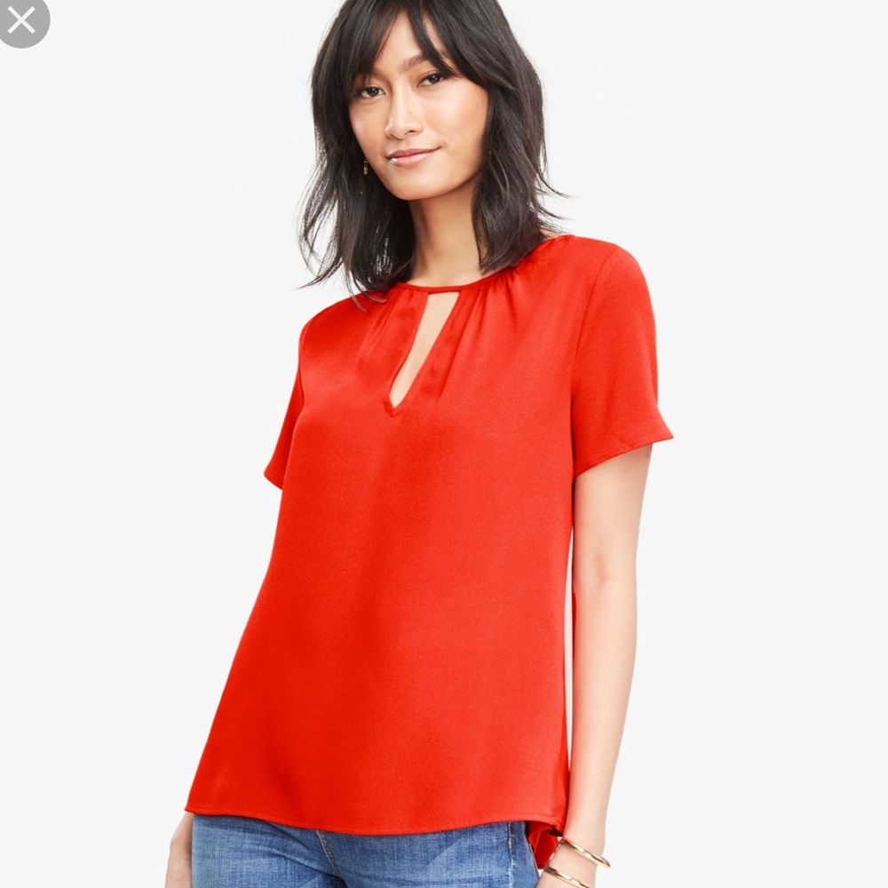NWOT Orange Keyhole peplum back Top